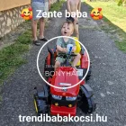 Gyermek vezeti a piros traktort a kertben